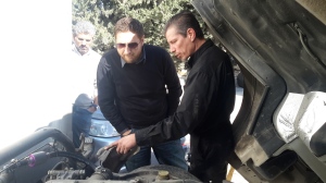 Mike Holler inspects a Smart Emissions Reducer installation and explains its functionality to NASCO's Engineer Mr. Mohammed Abdo, head of Business Development and Marketing Manager for Spare Parts Division. Joining them is Kabeer Minhas, Consultant to Extreme Energy Solutions.